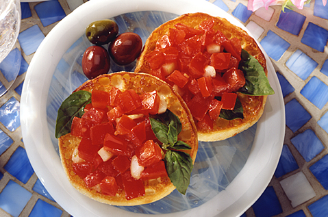 BAYS TOPPED WITH DICED TOMATO AND BASIL