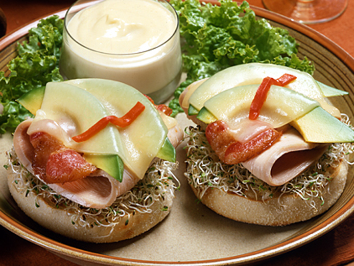 cheese, avocado, turkey, and bacon on a Bays English Muffin