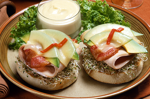 cheese, avocado, turkey, and bacon on a Bays English Muffin