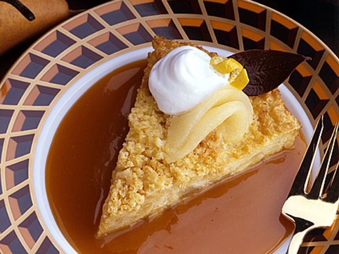 DESSERT SLICE WITH ICE CREAM TOPPED WITH ICE CREAM AND FRUIT