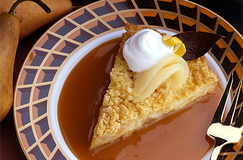 DESSERT SLICE WITH ICE CREAM TOPPED WITH ICE CREAM AND FRUIT