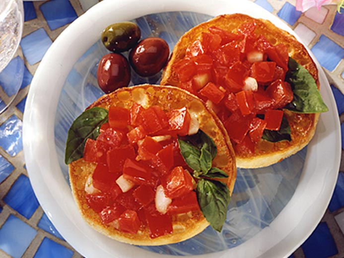 BAYS TOPPED WITH DICED TOMATO AND BASIL